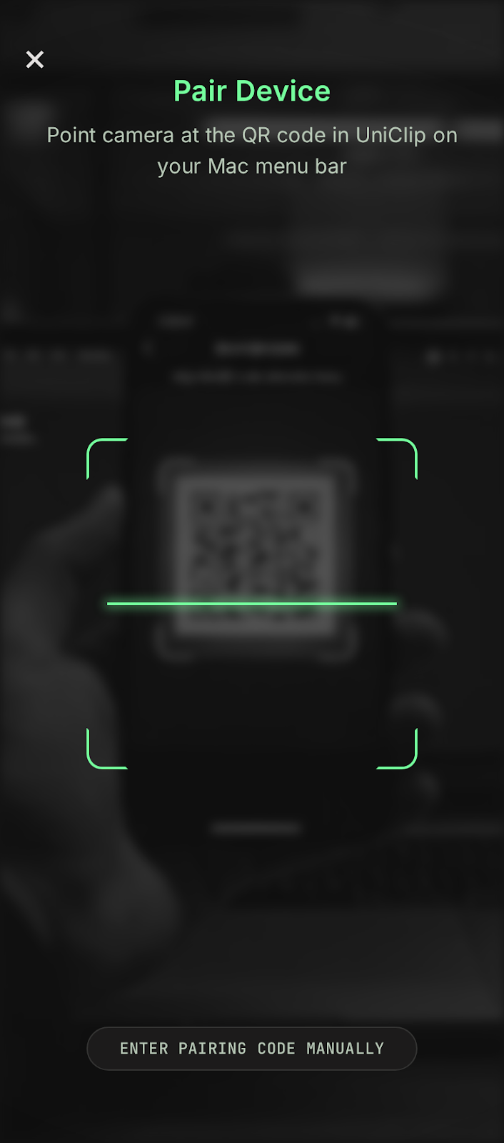 UniClip camera viewfinder with corner alignment brackets scanning the Mac pairing QR code